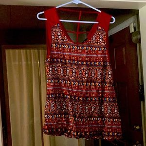 Rust colored sleeveless blouse
